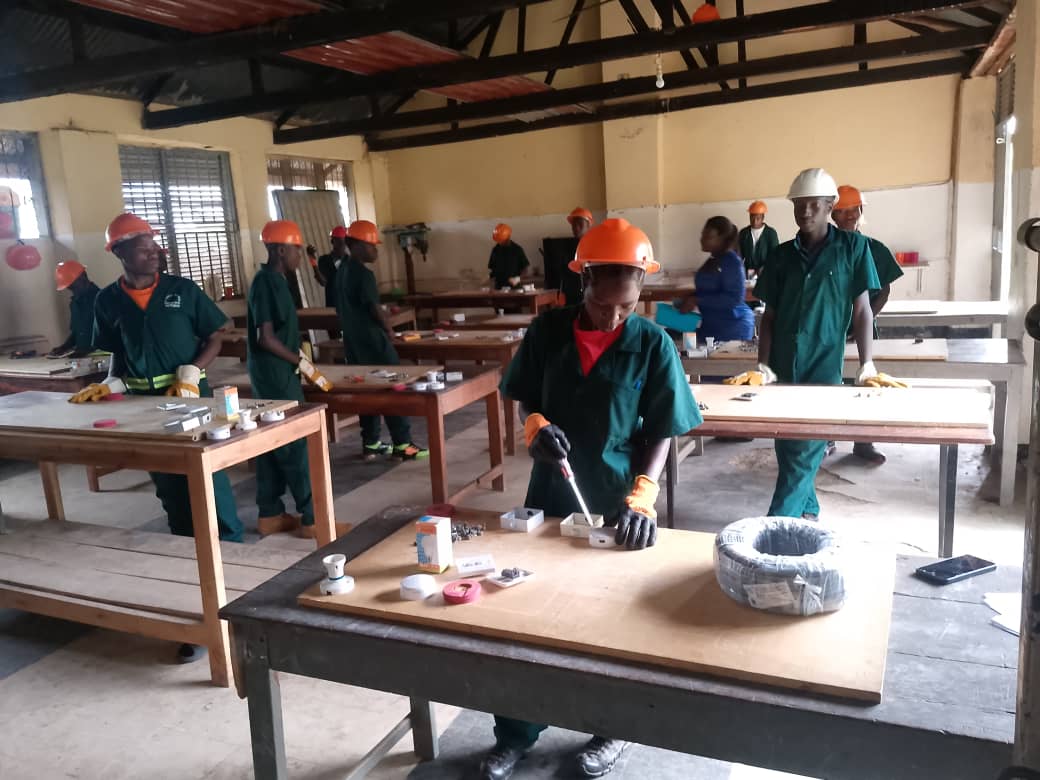 Youth practicing solar panel mounting